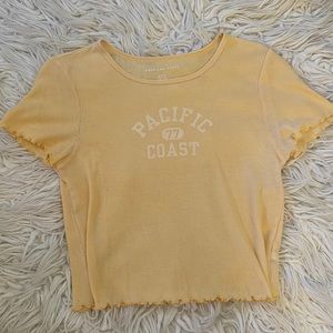 Yellow Pacific Coast 77 Baby Tee from American Eagle. Size Women’s Medium.